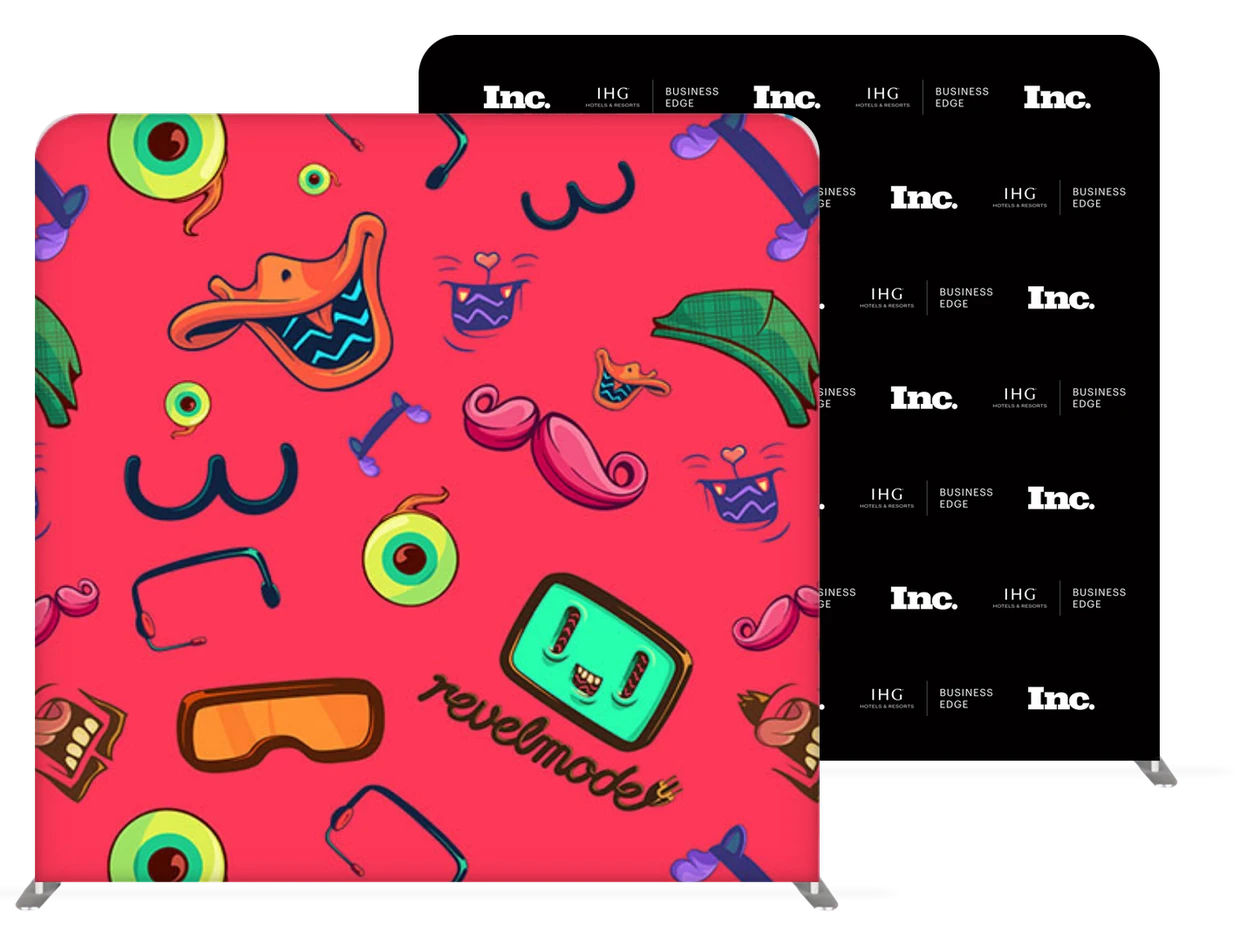 Two custom-printed backdrops: a red one patterned with illustrated photo booth props for Revelmode, and a black step-and-repeat with the Inc. and IHG Business Edge logos