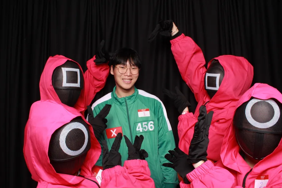 Students in costume at a college Halloween event photo booth